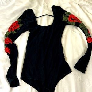 Body suit top with rose sleeve and open back